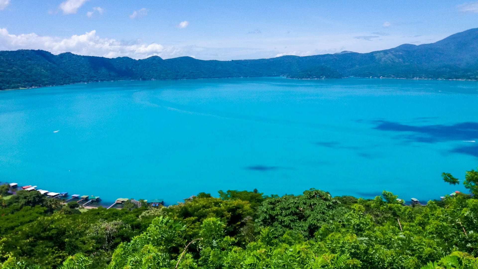 The crater water of Lake Coatepeque in the El Salvador coffee highlands.